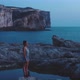 Young woman standing on the beach taking deep breaths - VideoHive Item for Sale