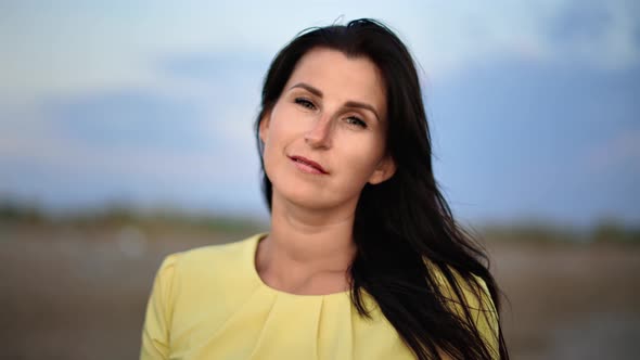 Portrait of Elegant Woman with Natural Beauty Posing Outdoor