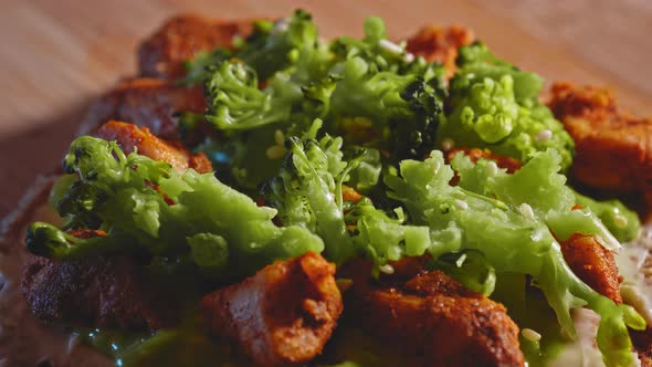 Sprinkling Sesame Seeds On Anabolic Toast Sandwich With Broccoli And Chicken Breast. close up