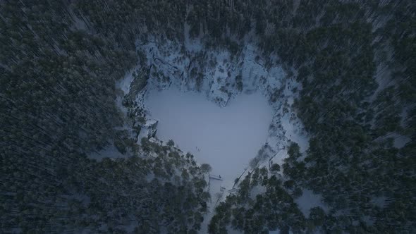 Flooded heart-like talc quarry "Talc stone" in forest near the Sysert city. Aerial, winter 04