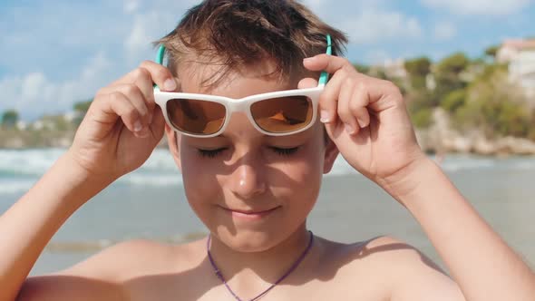 Cheerful Boy Relaxing at Coastline