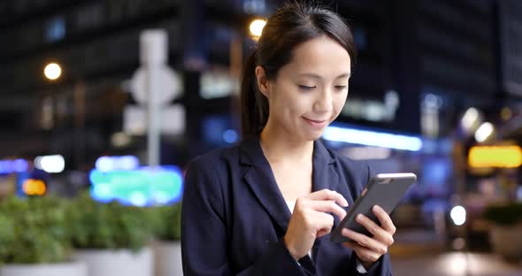 Young woman use of mobile phone in city