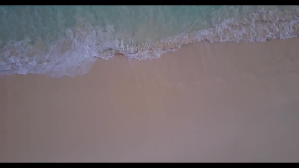 Aerial drone texture of marine resort beach voyage by blue green sea and white sand background of a 