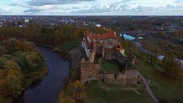 Bauska Medieval Castle Ruins Complex and Park From Above Aerial Shot 4K Video