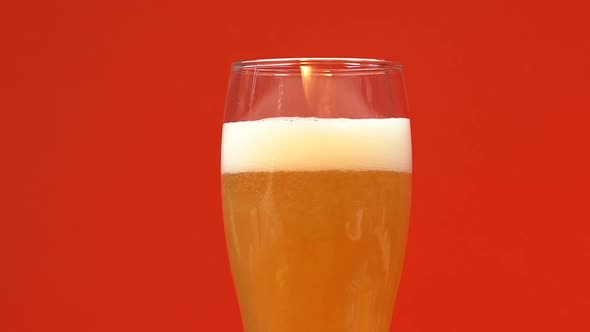 Glass of Cold Light Beer With Foam, Refreshing Summer Craft Drink, Close Up