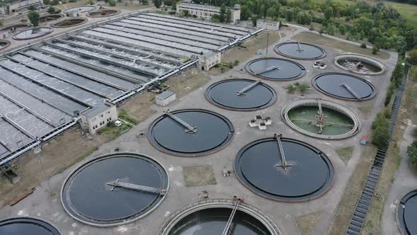 Aerial Flying Over a Water Treatment Plant Facility. Aeration Station. Round Sedimentation Tanks