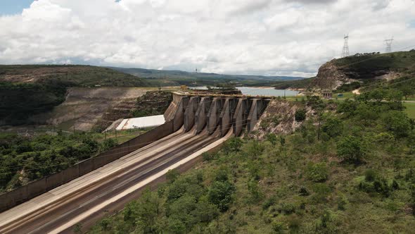 Cinematic drone footage - flying sideways over the river showing a hydroeletric at minas gerais in B