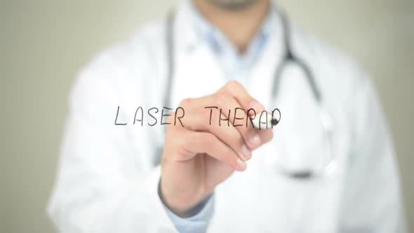 Laser Therapy, Doctor Writing on Transparent Screen