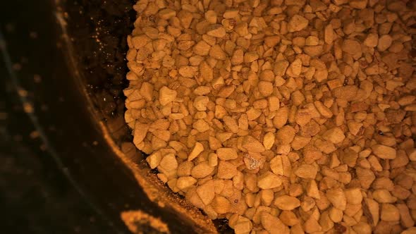 Instant Coffee Granules of Brown Colour in Metal Cup Macro