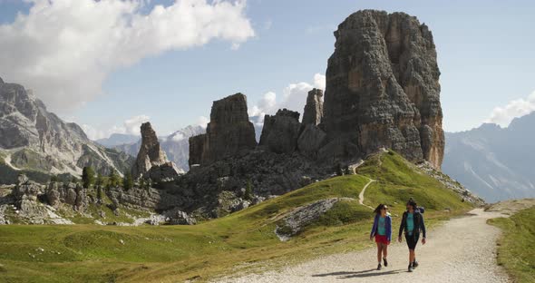 Man and Woman Couple Hiking Along Cinque Torri Trail Path