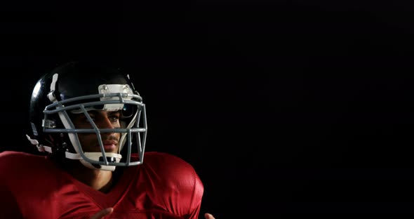 American football player catching the ball