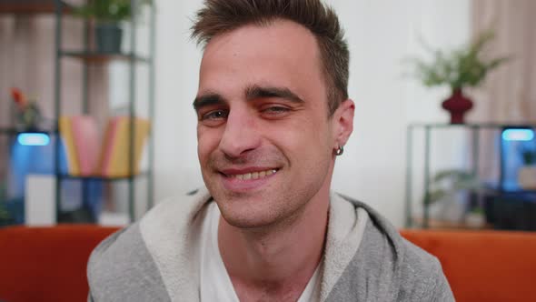 Portrait of Happy One Handsome Teenager Unshaved Man Boy Smiling Looking at Camera at Home on Couch