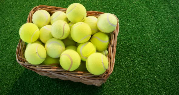 Tennis balls in wicker basket at studio 4k