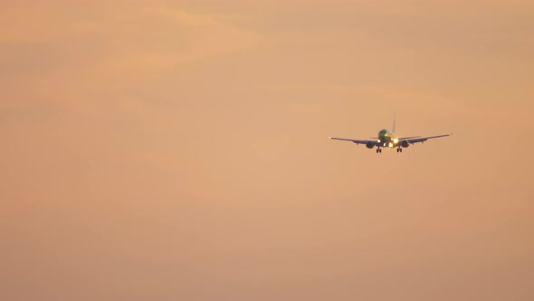 Airplane Landing at Dawn