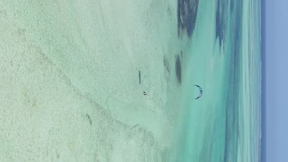 Zanzibar Tanzania  Vertical Video Kitesurfing Near the Shore of Ocean Slow Motion