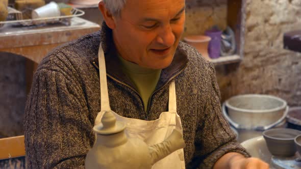 Potter working on clay sculpture