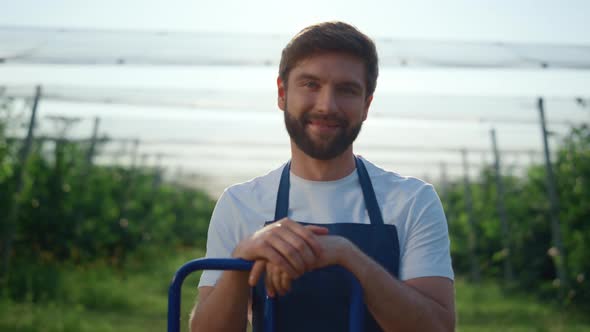 Cheerful Entrepreneur Looking Camera at Agriculture Plantation in Summer