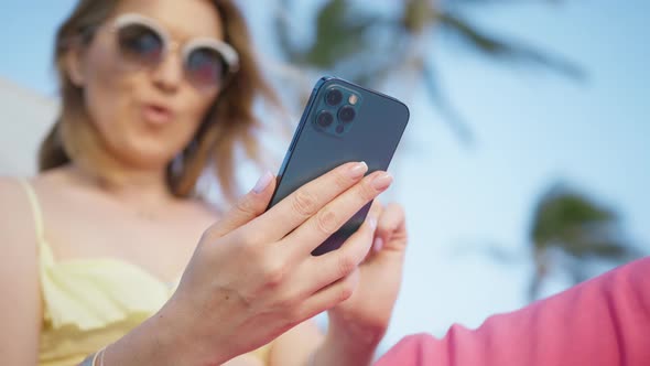 Happy Caucasian Young Woman Holding Cell Phone Using Smartphone Device Vacation