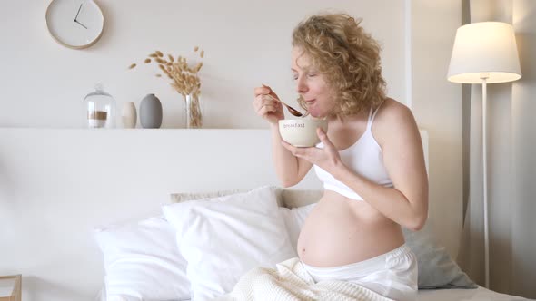 Hungry Pregnant Woman Having Breakfast, Pregnancy Cravings