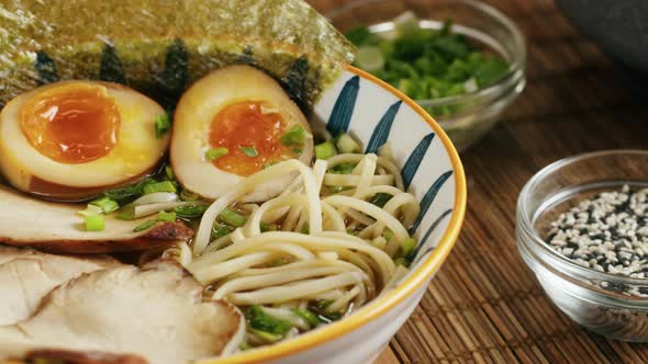 Japanese Ramen Asian Soup Noodle with Beef or Chicken Meat Mushroom and Eggs Chef Cooking in