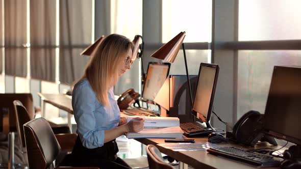 Focused Barrister Reading Corporate Financial Audit Report Document. Lawyer Analyzing Charts.