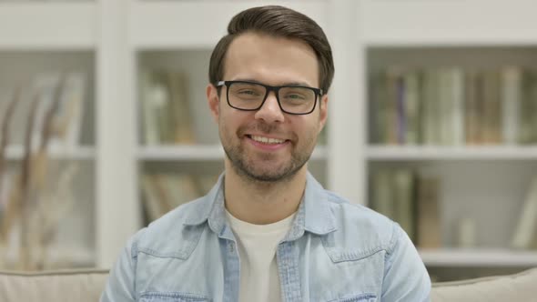 Portrait of Young Man Smiling at the Camera