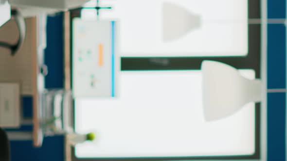 Successful Senior Entrepreneur Standing in Front of Meeting Desk Looking at Camera