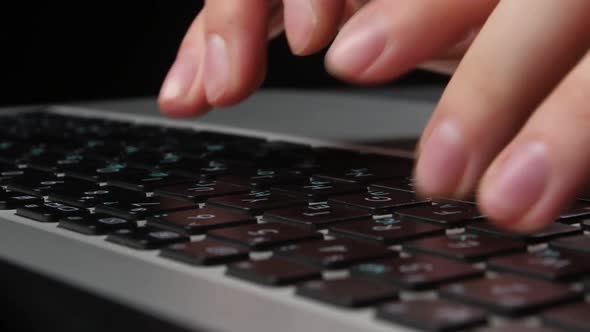 Both Hands of an Office Worker Typing on Keyboard, Front View, Close Up, Black