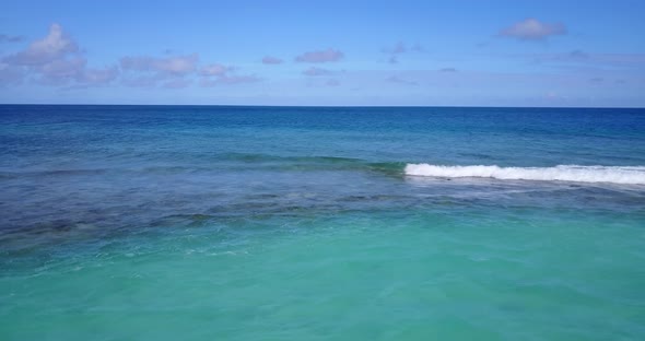 Beautiful birds eye abstract view of a white sand paradise beach and blue ocean background in hi res