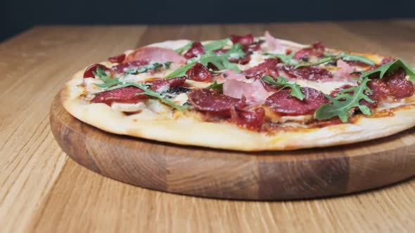 Appetizing Pizza on a Wooden Board in a Restaurant