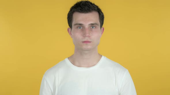 Happy Young Man Isolated on Yellow Background