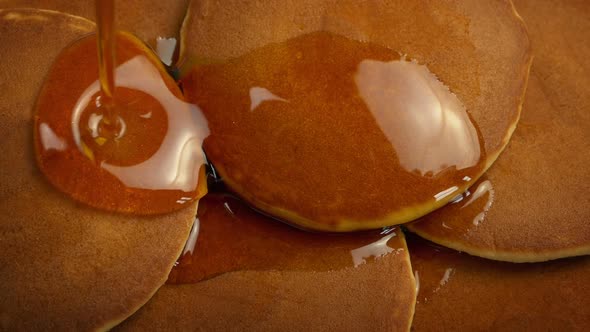 Syrup Pouring On Breakfast Pancakes