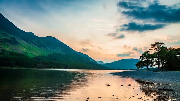 Stunning dusk over the lake and mountains in the Lake District in the UK, 4k, timelapse