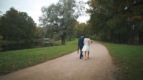 Newly Married Couple Walk Together