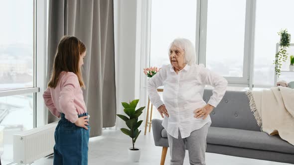 Grandmother and Granddaughter Exercising