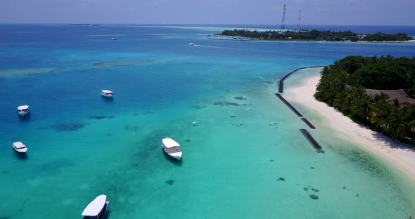 Tropical overhead travel shot of a white paradise beach and aqua blue water background in high resol