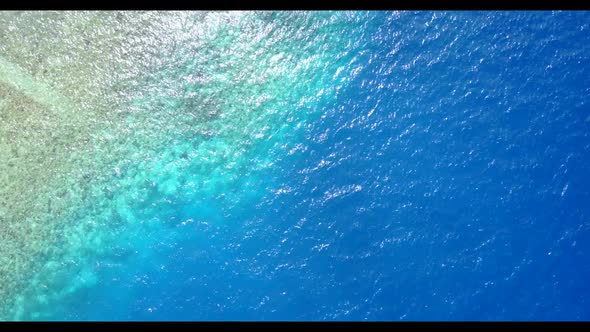 Aerial drone view sky of idyllic tourist beach journey by aqua blue sea and white sand background of