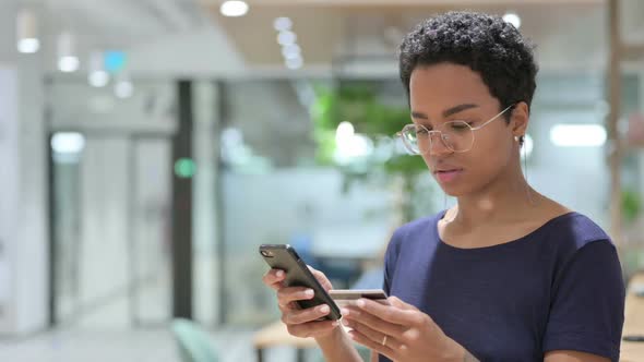 Portrait of Online Payment Loss on Smartphone By African Woman