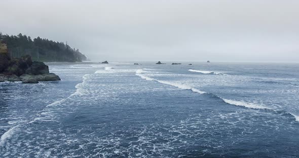 Fog on the ocean horizon with protruding rocks at Ruby Beach, Olympic National Park, Washington, USA