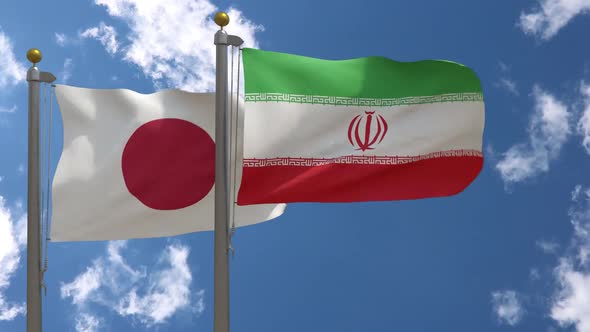 Japan Flag Vs Iran Flag On Flagpole