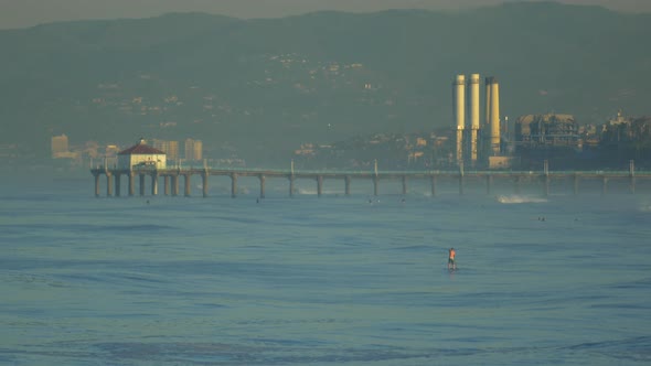 The Manhattan Beach pier sits majestic over the Pacific Ocean.