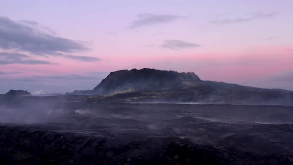 Steam Rising From The Ground Around A Volcano After Eruption. Post Volcanic Activity Sunset View. wi