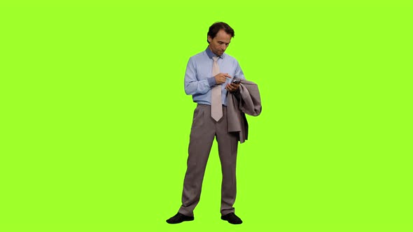 Adult Business Man Using Smartphone on Green Background