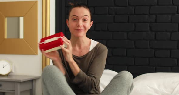 Woman Showing Gift By Video Call