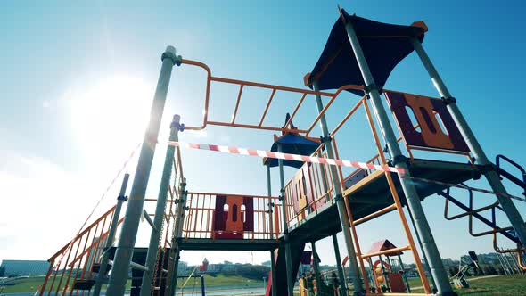 Children's Playground with a Warning Tape on It