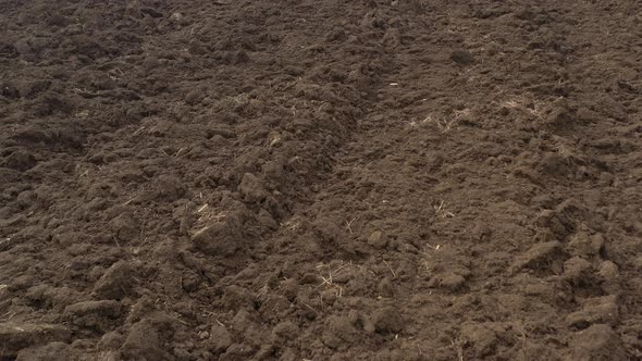 Fertile soil after being ploughed 4K drone footage