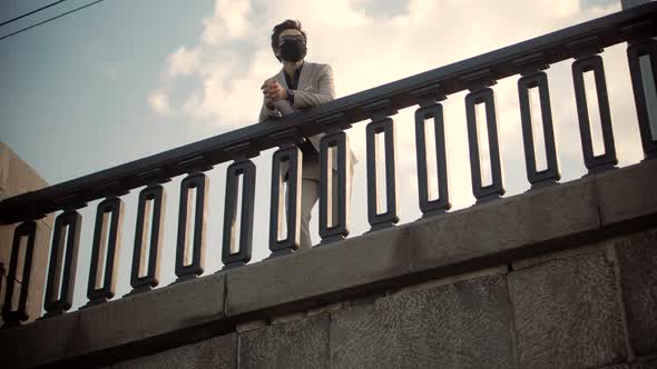 Businessmen In Suit Stroll On City Bridge.Businessman In Suit Walks On Quay. Man In Enjoying On Pier