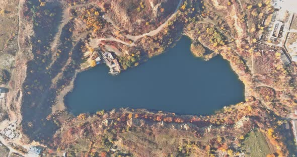 There is a Clear Turquoise Water in the Water of a Quarry Pond That Rose From the Mining of Stone