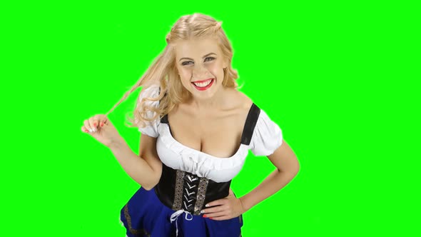 Bavarian Woman Flirty Winds To Finger a Strand of Hair and Smiling. Green Screen