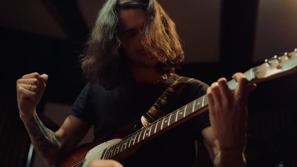 Satisfied Man Rehearsing in Dark Hall. Excited Guy Playing in Music Studio.